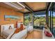 Bright bedroom featuring two beds with playful decor and expansive windows overlooking the outdoor scenery at 7686 E Stagecoach Pass Rd, Carefree, AZ 85377