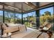 Bright bedroom features floor-to-ceiling windows with natural views and a cozy reading nook at 7686 E Stagecoach Pass Rd, Carefree, AZ 85377