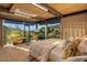 Bright bedroom with scenic views, stylish seating, and a cozy ambiance at 7686 E Stagecoach Pass Rd, Carefree, AZ 85377