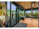 Bright entryway featuring a desert view, modern decor and glass doors at 7686 E Stagecoach Pass Rd, Carefree, AZ 85377