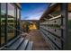 Stylish home featuring a metal frame, wooden walkway, and desert landscaping at 7686 E Stagecoach Pass Rd, Carefree, AZ 85377