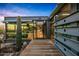 Contemporary home with steel construction, a wooden walkway, and desert views at 7686 E Stagecoach Pass Rd, Carefree, AZ 85377