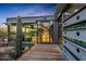 Modern home with a desert landscape and a wooden walkway at 7686 E Stagecoach Pass Rd, Carefree, AZ 85377