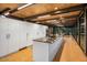 Spacious, modern kitchen boasts sleek white cabinets, a marble island, and high-end appliances at 7686 E Stagecoach Pass Rd, Carefree, AZ 85377