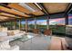 Bright living room with floor to ceiling windows showcasing desert views and modern seating at 7686 E Stagecoach Pass Rd, Carefree, AZ 85377