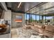 Open-concept living room with a comfortable sectional sofa, modern decor, and expansive windows at 7686 E Stagecoach Pass Rd, Carefree, AZ 85377