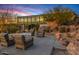 Elegant outdoor patio with modern seating, a fire pit, and desert landscaping perfect for entertaining at 7686 E Stagecoach Pass Rd, Carefree, AZ 85377