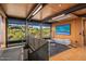 Upstairs seating area with staircase, television, desert views, and sleek decor at 7686 E Stagecoach Pass Rd, Carefree, AZ 85377