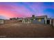 View of the backyard showing the exterior of the home and yard at 7906 W Catalina Dr, Phoenix, AZ 85033