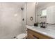 Bathroom showcasing modern fixtures, including a marble walk-in shower at 7906 W Catalina Dr, Phoenix, AZ 85033