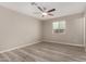 Comfortable bedroom with neutral walls and a bright window with neighborhood views at 7906 W Catalina Dr, Phoenix, AZ 85033