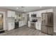 Beautiful kitchen with white cabinets, stainless steel appliances, and an integrated wine cooler at 7906 W Catalina Dr, Phoenix, AZ 85033