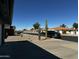 Residential street with desert landscaping at 8235 E Medina Ave, Mesa, AZ 85209