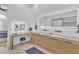 Modern main bathroom with double vanity, illuminated mirrors, and a sleek design at 8245 E Bell Rd # 201, Scottsdale, AZ 85260