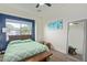 Inviting bedroom featuring a bright window, mirrored wall, and natural light, creating a serene retreat at 844 W Beechnut Dr, Chandler, AZ 85248