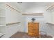 Well-organized walk-in closet with wooden shelving and drawers providing ample storage space at 844 W Beechnut Dr, Chandler, AZ 85248