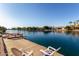 Backyard waterfront view featuring lounge chairs and picturesque views of the community at 844 W Beechnut Dr, Chandler, AZ 85248