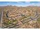 Scenic aerial view of a community in the desert with mountain views at 8525 E Lynwood St, Mesa, AZ 85207