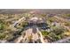 Aerial view of the clubhouse, pool, and parking lot, surrounded by lush landscaping in this desirable community at 8525 E Lynwood St, Mesa, AZ 85207