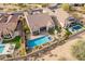 Aerial view of backyard oasis with pool, spa, patio, and landscaping at 8525 E Lynwood St, Mesa, AZ 85207