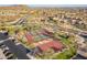 An aerial of the community with multiple tennis courts and a basketball court at 8525 E Lynwood St, Mesa, AZ 85207