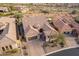 Aerial view of home showcasing desert landscaping, circular drive, and elegant architecture at 8525 E Lynwood St, Mesa, AZ 85207