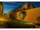 Backyard with a putting green, rock landscaping, desert plants and block wall at twilight at 8525 E Lynwood St, Mesa, AZ 85207