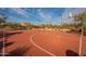 A red basketball court with basketball hoops on either side at 8525 E Lynwood St, Mesa, AZ 85207