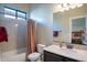 Bathroom with shower/tub combination and a marble vanity at 8525 E Lynwood St, Mesa, AZ 85207