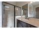 Elegant bathroom with a marble shower, and a large vanity and mirror, and marble counter at 8525 E Lynwood St, Mesa, AZ 85207