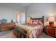 Bedroom with a colorful bedframe and a wooden dresser at 8525 E Lynwood St, Mesa, AZ 85207