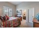 Bedroom with a colorful bedspread and a red nightstand at 8525 E Lynwood St, Mesa, AZ 85207