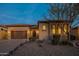 Exterior view of home featuring a lush landscaped front yard with desert landscaping at 8525 E Lynwood St, Mesa, AZ 85207