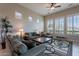 Comfortable living room with high ceilings, ample natural light, and stylish contemporary furnishings at 8525 E Lynwood St, Mesa, AZ 85207