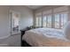 Bright main bedroom with plantation shutters on the windows and a doorway to the patio at 8525 E Lynwood St, Mesa, AZ 85207