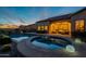 Backyard pool and spa with beautiful hardscape and relaxing lighting at 8525 E Lynwood St, Mesa, AZ 85207