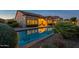 Backyard pool reflecting the home's architecture at twilight at 8525 E Lynwood St, Mesa, AZ 85207