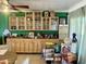 Custom-built-in cabinets and shelving providing ample storage and display options in this room at 8732 E Arlington Rd, Scottsdale, AZ 85250