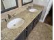 Bathroom with double sinks, granite counters, and tiled floors at 9043 E Posada Ave, Mesa, AZ 85212