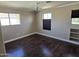 Bedroom with multiple windows, ceiling fan, and built-in shelving at 9043 E Posada Ave, Mesa, AZ 85212