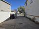 An extended driveway looking out toward a common area at 9043 E Posada Ave, Mesa, AZ 85212