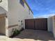 A view of the side of a white stucco home with a fenced in private yard and a blue sky above at 9043 E Posada Ave, Mesa, AZ 85212