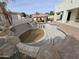 A vacant pool and a tiled pool deck on a sunny day at 9043 E Posada Ave, Mesa, AZ 85212