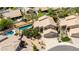 Aerial view of a home featuring a private pool, desert landscaping, and a two-car garage at 9812 E Karen Dr, Scottsdale, AZ 85260
