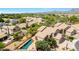 Aerial view of a home showcasing a private pool with desert landscaping and mountain views in the distance at 9812 E Karen Dr, Scottsdale, AZ 85260