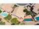 Charming aerial view of a backyard featuring a pool and brick patio with desert landscaping at 9812 E Karen Dr, Scottsdale, AZ 85260