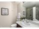 Cozy bathroom featuring a shower, a single sink, and neutral wall color at 9812 E Karen Dr, Scottsdale, AZ 85260