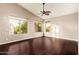 Spacious bedroom featuring vaulted ceilings, a ceiling fan, and plenty of natural light from large windows at 9812 E Karen Dr, Scottsdale, AZ 85260