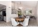 Well-lit dining area features an open layout to the staircase, entry and kitchen at 9812 E Karen Dr, Scottsdale, AZ 85260
