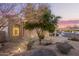 Charming front yard with desert landscaping, native plants and a walkway leading to the entrance at 9812 E Karen Dr, Scottsdale, AZ 85260